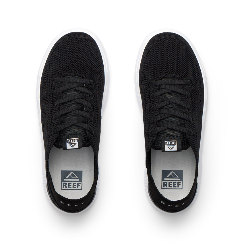 Top view of black Kids Neptune sneakers with breathable knit upper, white sole, and surf-inspired comfort design.