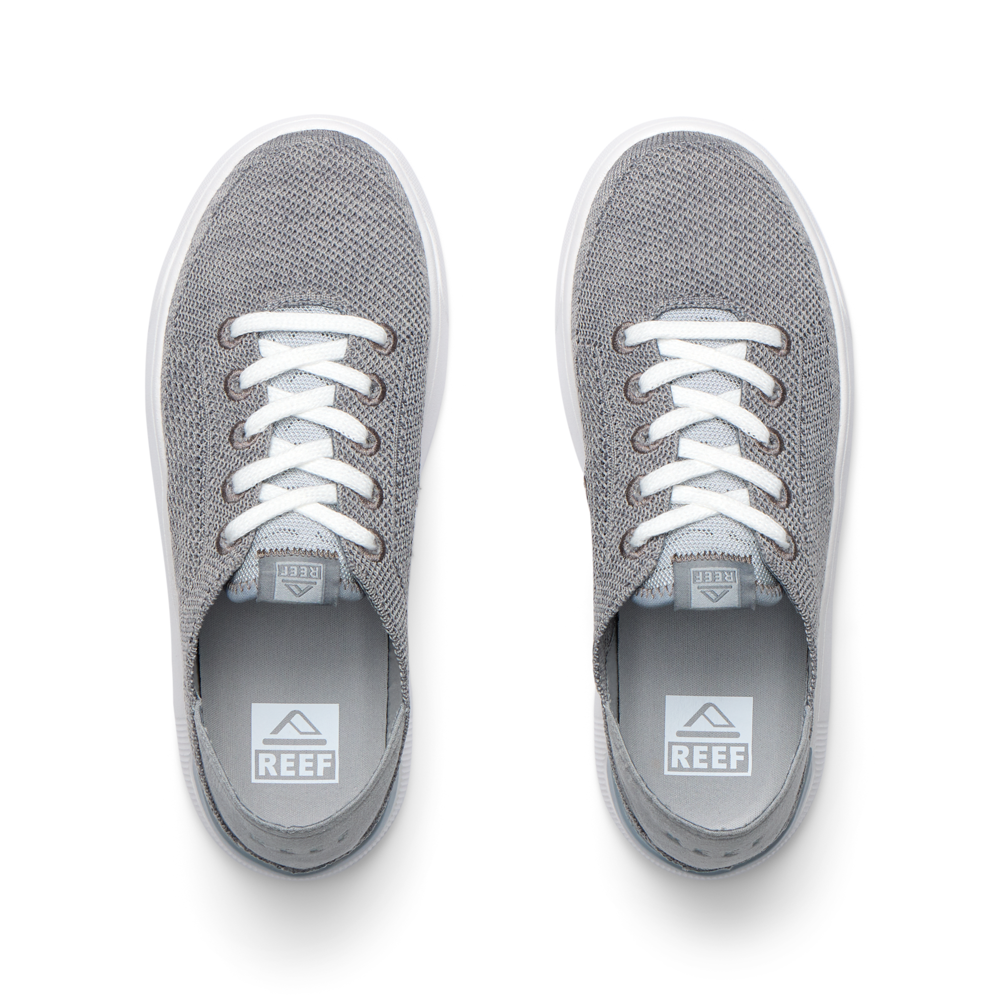 Top view of grey Kids Neptune sneakers with breathable knit upper, white laces, and lightweight cushioned sole facing forward