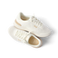 Shoreline Palisades women's white sneaker pair with right shoe facing up, showcasing comfort and surf-inspired design.