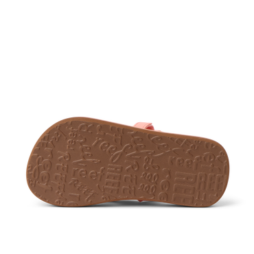 Little Ahi girls’ sandal sole facing up, showing textured outsole with Reef branding, comfort-focused and durable design.
