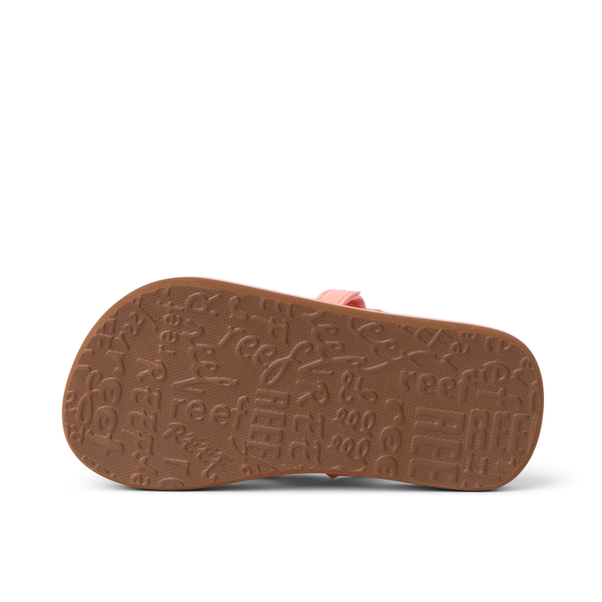Little Ahi girls’ sandal sole facing up, showing textured outsole with Reef branding, comfort-focused and durable design.