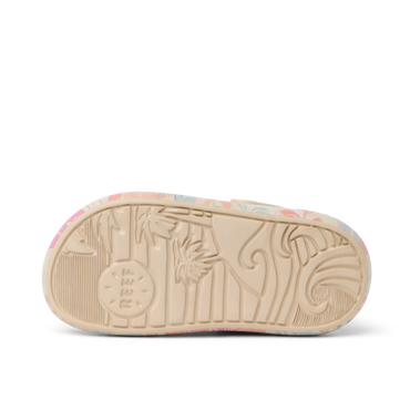 Little Rio Slide showing bottom sole facing up with embossed reef logo and surf-inspired patterns in apricot multi colors.