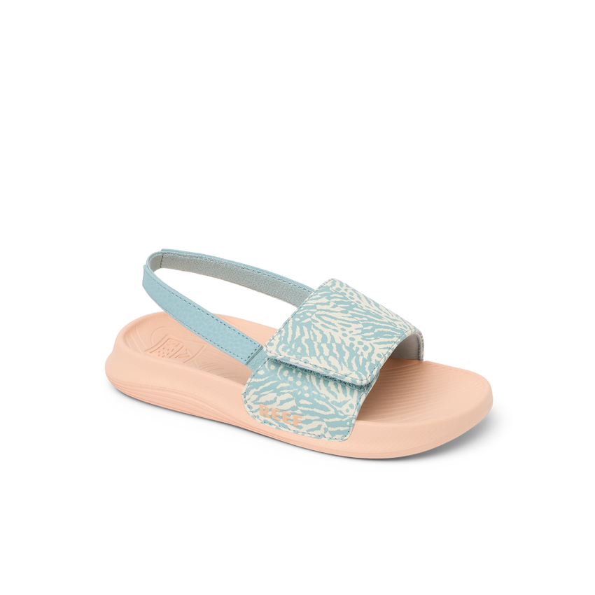 Little Salty Slide sandal for girls facing right, showing side and top with soft cushioning and arch support in blue haze pattern.