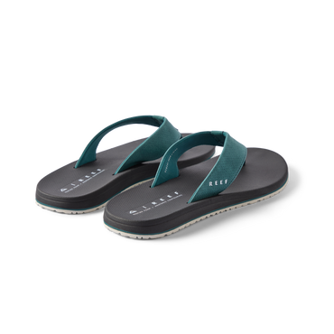 Pair of Nox men's teal and black flip flops facing right, featuring soft cushioning and anatomical arch support.