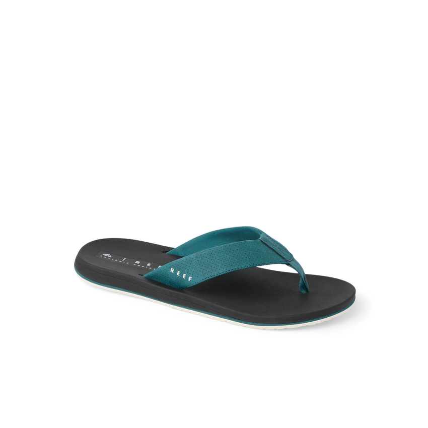 Nox men's sandal facing right, close-up of teal strap and black cushioned footbed with arch support and water-friendly design.