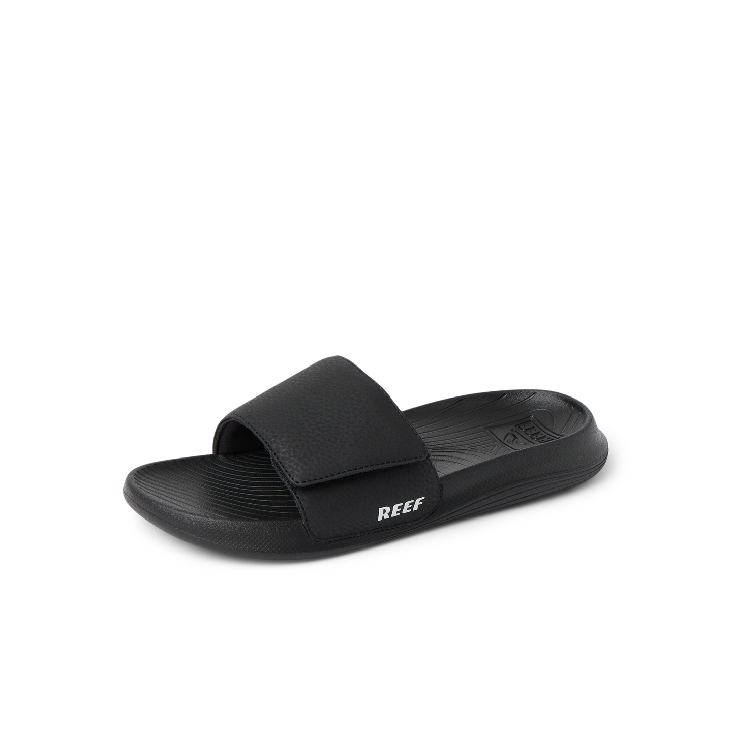 Kids Salty Slide in black facing left, close-up of the top and side showing cushioned footbed and adjustable strap.