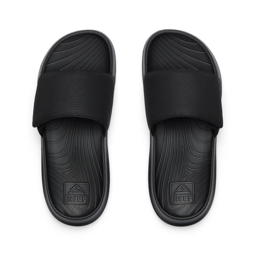 Kids Salty Slide top view showing black water-friendly slides with anatomical arch support and soft cushioning for boys.