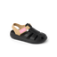 Little Totally Beachin girls sandal facing left, black and tan with arch support and soft cushioning for beach comfort.