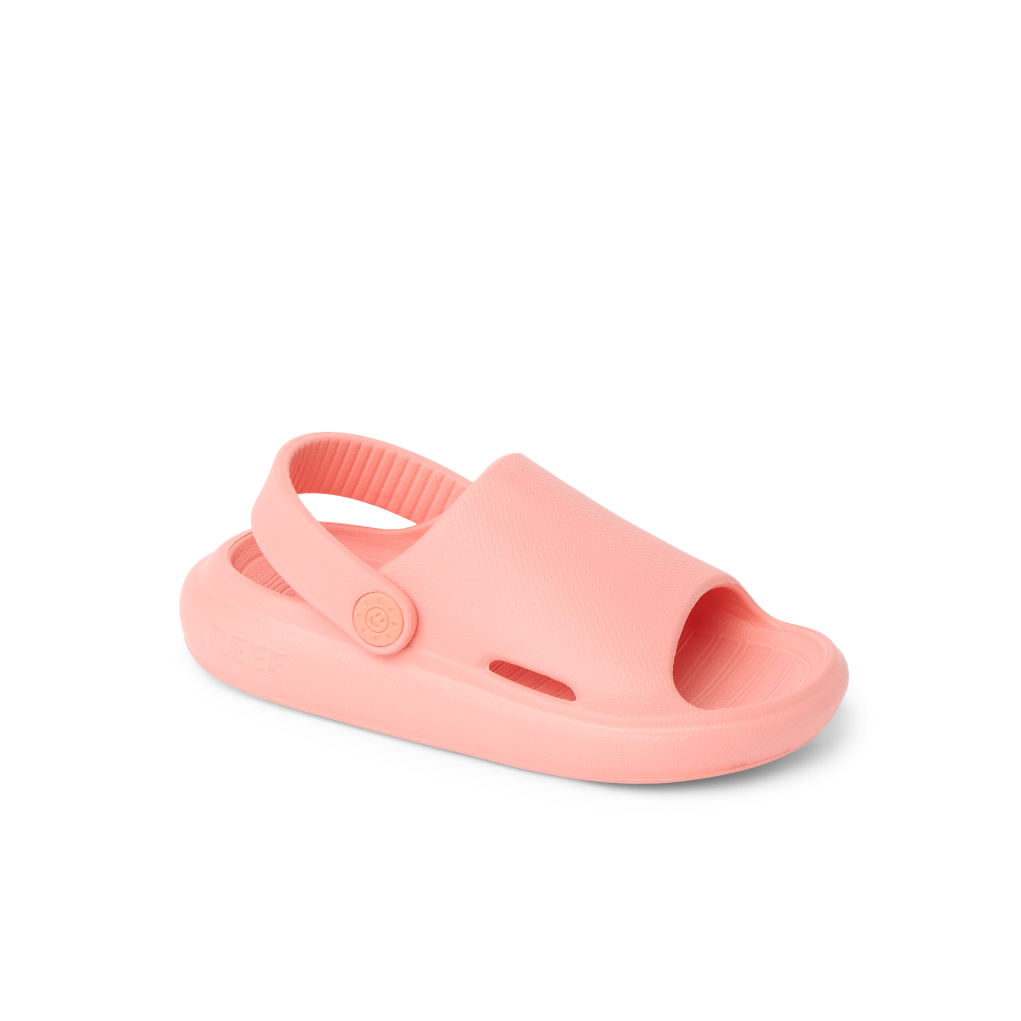 Little Rio Slide coral-colored kids’ slide sandal facing left, showing top and side with comfortable cushioned sole.