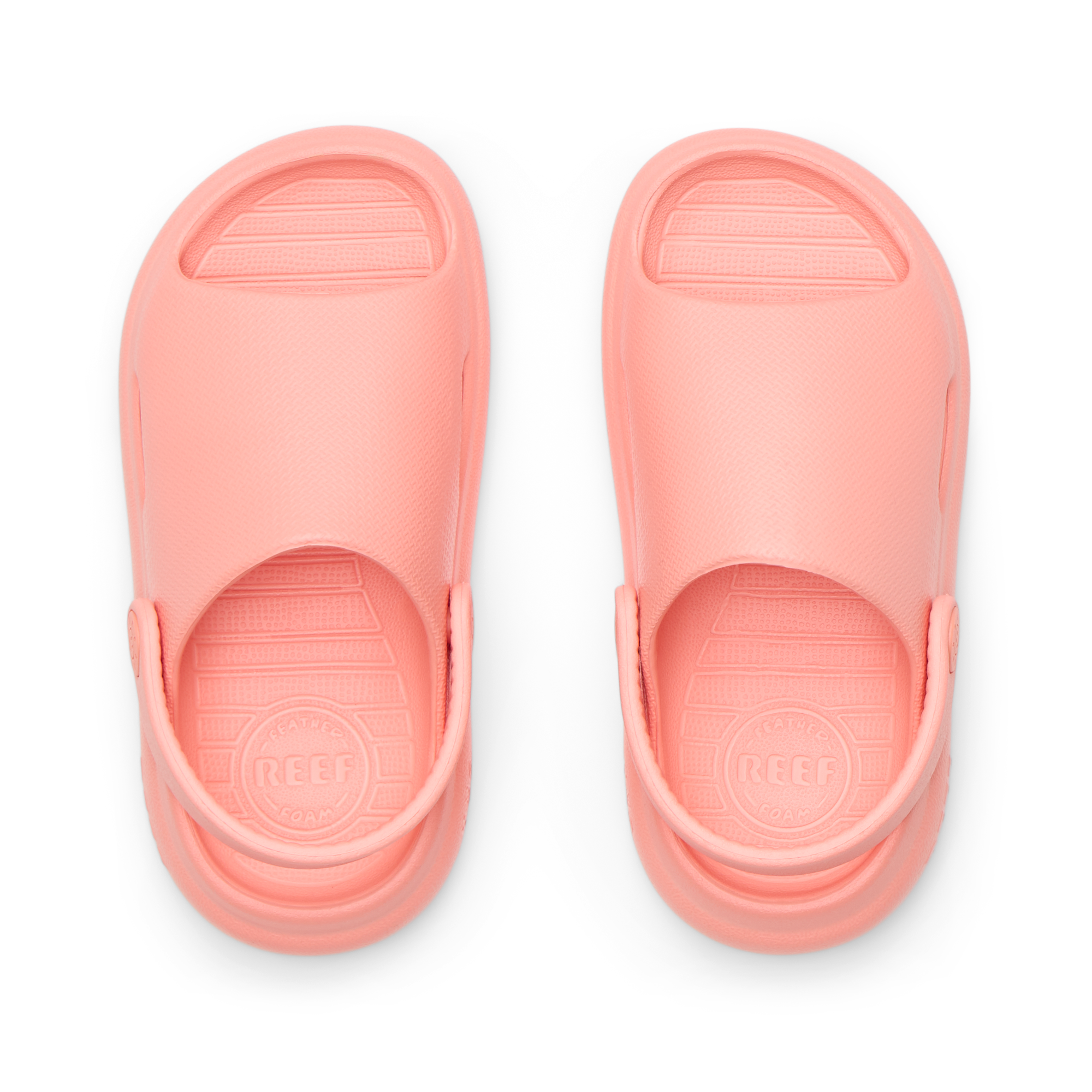 Top view of coral Little Rio Slide sandals for kids with molded footbeds and soft cushioning for beach comfort.