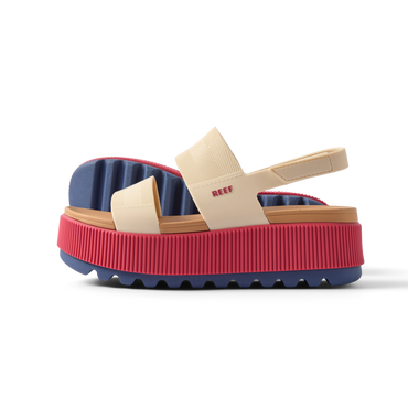 Water Vista Higher women's sandal facing left with pink platform sole, beige straps, and blue cushioned footbed.