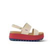 Side view of Water Vista Higher women's sandal with thick red platform sole and beige straps, surf-inspired comfort footwear.