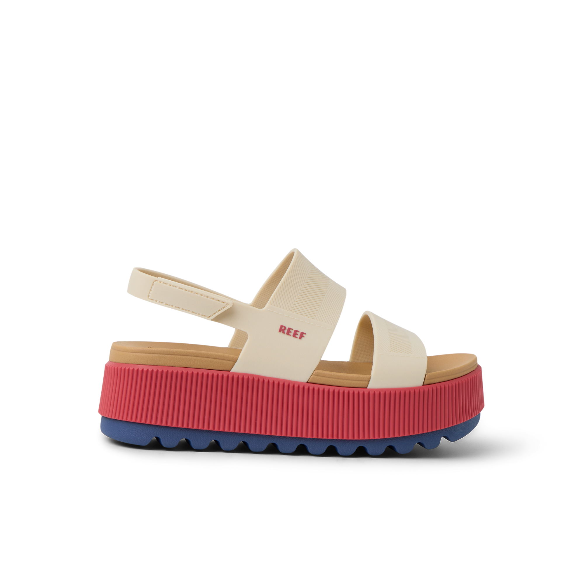 Side view of Water Vista Higher women's sandal with thick red platform sole and beige straps, surf-inspired comfort footwear.