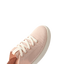 Reef Neptune sneaker facing left, close-up of front and toe area with breathable rose blossom fabric and comfort features.