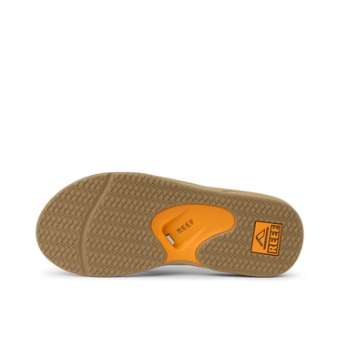 Fanning men's sandal sole facing up showing orange REEF arch support, soft-rebound cushioning, beach-ready comfort