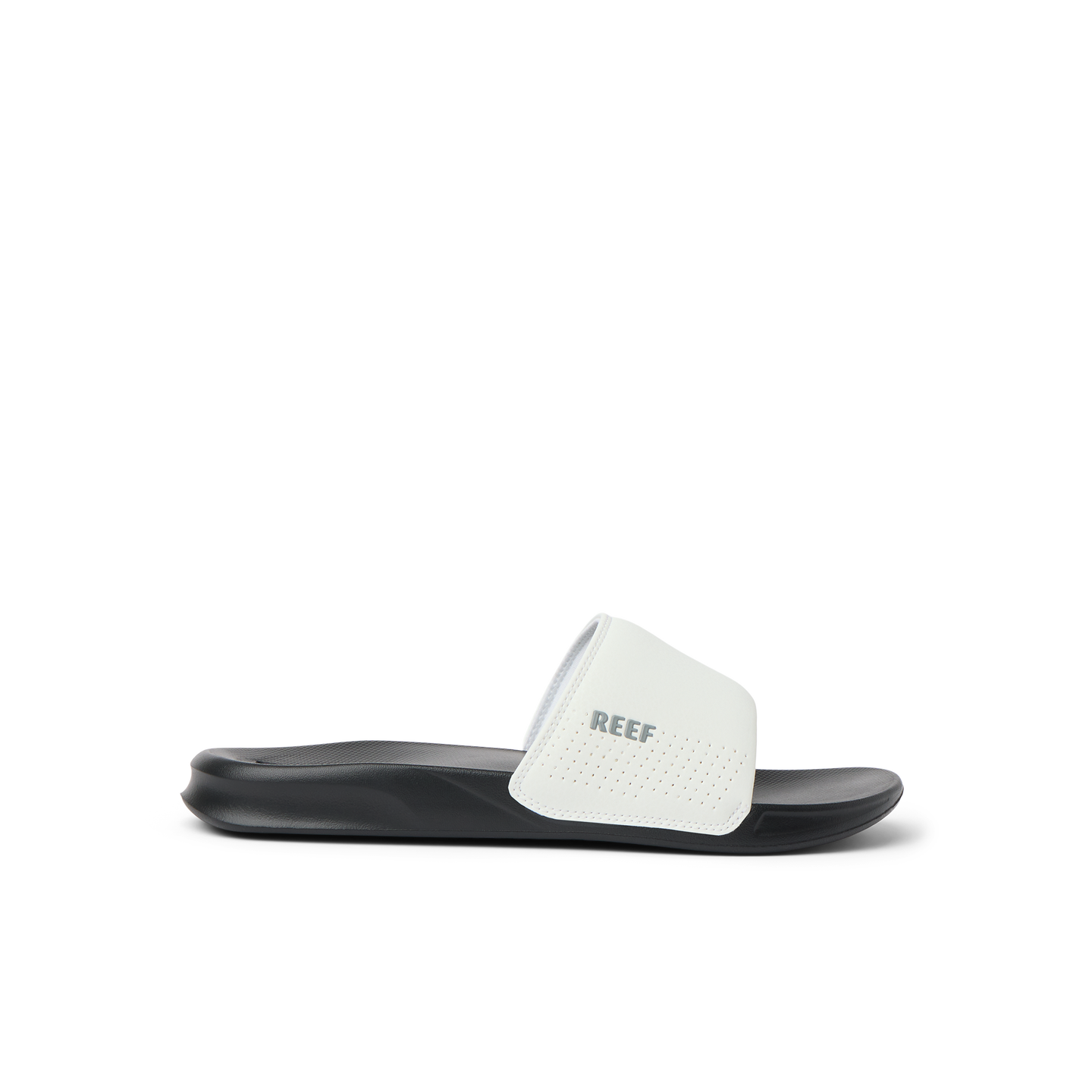 Side view of a black and white Reef One Slide sandal, water friendly and designed for beach comfort and support.