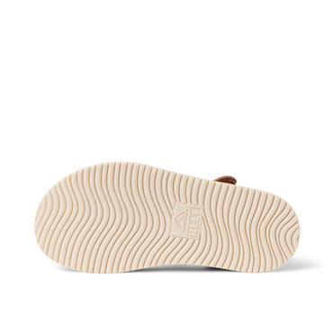 Little Cali Coastin water friendly sandal outsole viewed from below with toe facing right and wavy traction pattern