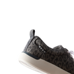 Neptune Alana women's shoe facing left, close-up of heel and side, featuring denim cheetah print and cushioned support.