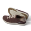 Neptune HT brown sneakers facing left with cushioned soles and textured outsoles