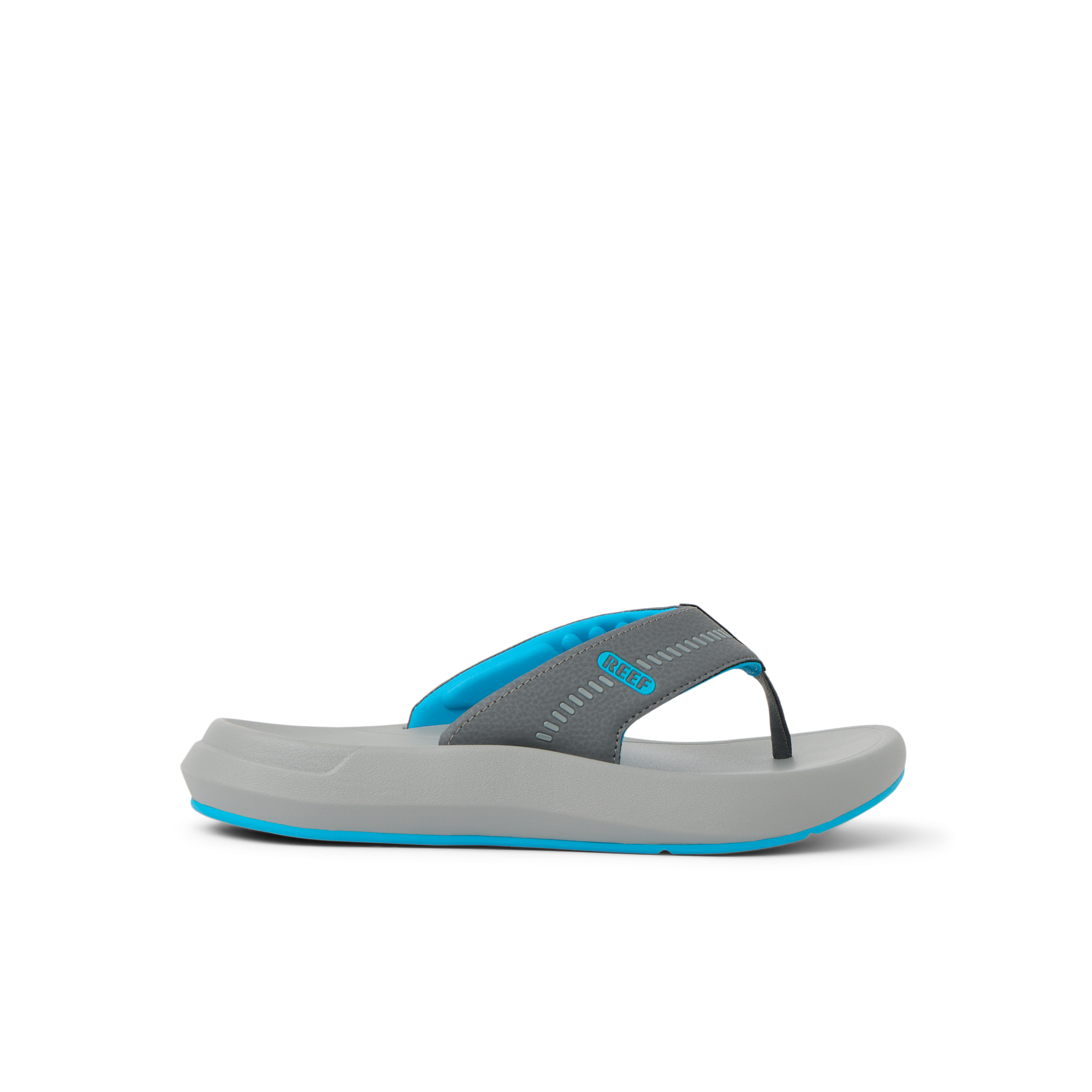 Cruiser flip flop facing right with charcoal gray straps, aqua accents, and cushioned sole for beach comfort by REEF.