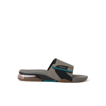 Fanning + Slide facing right, men's water-friendly sandal in tan and spruce with oversized airbag heel and REEFlex cushioning