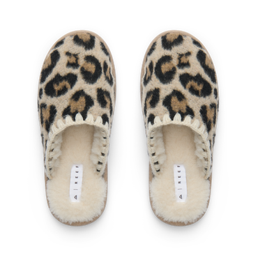 Iryss Slipper pair facing upward with leopard print uppers and plush fleece lining