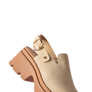 Vista Luxe Solene clog facing left, close-up of front and adjustable buckle strap, premium suede with platform sole.