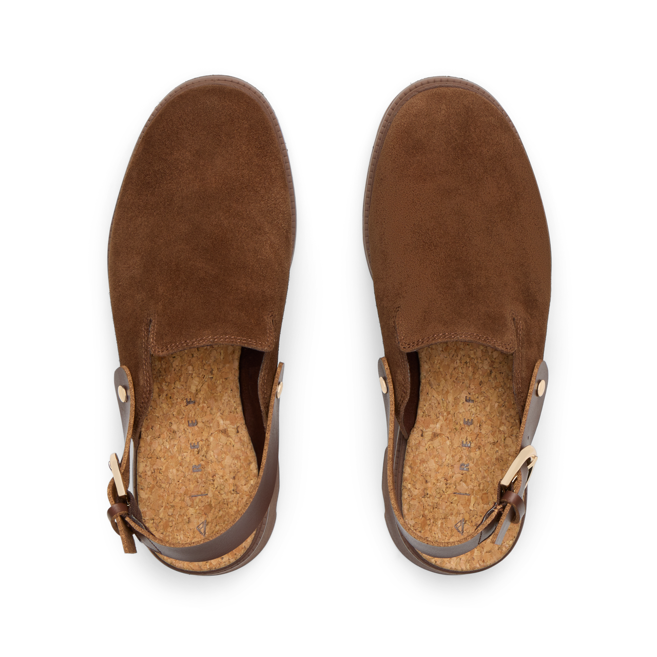 Top-down view of brown suede Vista Luxe Solene clogs facing upward, featuring adjustable buckle straps and cushioned footbeds.