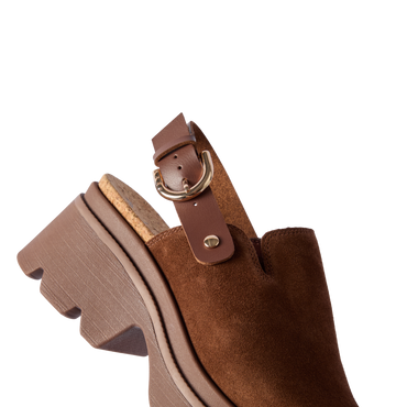 Vista Luxe Solene brown suede clog facing left, close-up of front and adjustable buckle strap with platform sole.