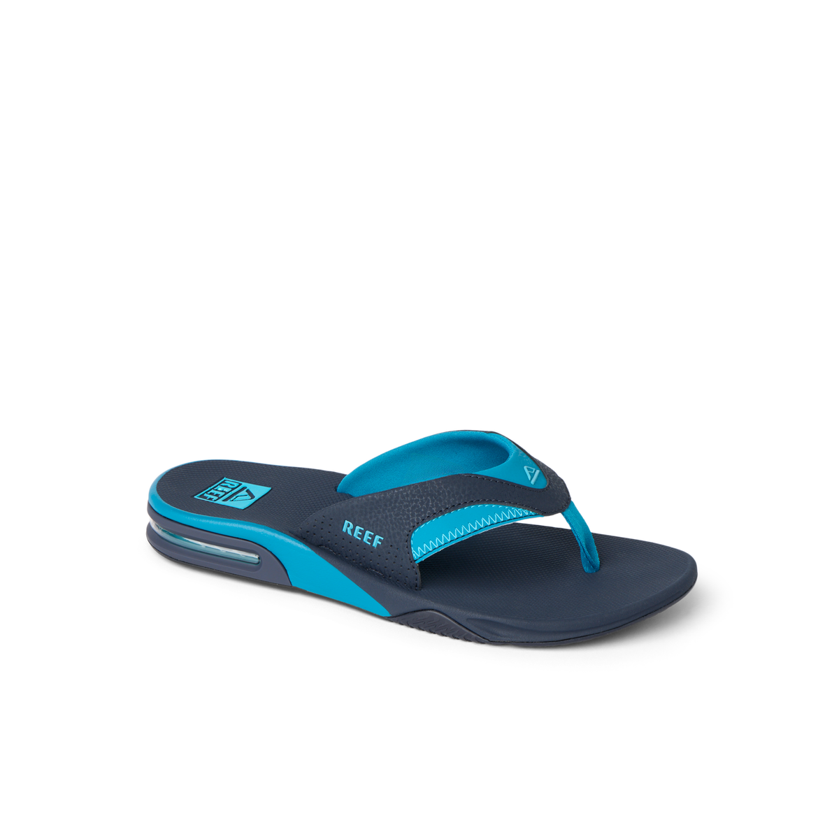 REEF Fanning blue flip flop facing right with cushioned footbed and arch support