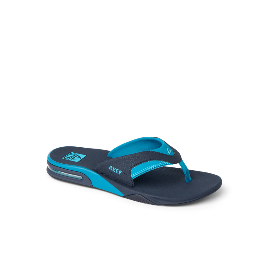 REEF Fanning blue flip flop facing right with cushioned footbed and arch support