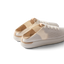 Reef Neptune women's white champagne breathable slip-on sneaker facing left, showing heel and side view