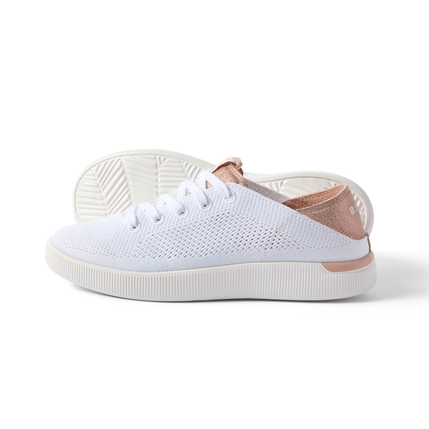 Reef Neptune white and rose gold women's sneaker facing right, showing side and sole, lightweight and breathable design.