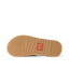 Free Fly X Ojai sandal outsole facing up, showing durable rubber tread with flex grooves and branded logo patch center