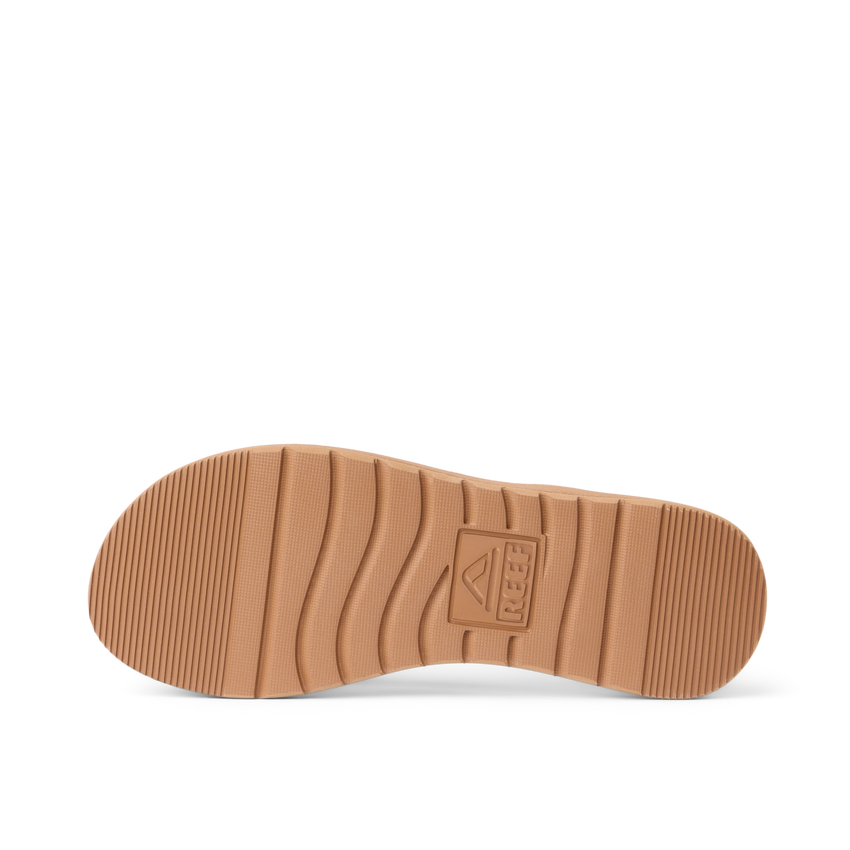 Close up of Playa Bella flip flop outsole facing up with toe pointing left and textured traction grooves