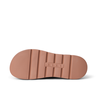 Close up of Cali Laguna sandal outsole facing right with ribbed traction cushioned platform sole and REEF logo