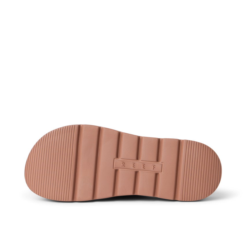 Close up of Cali Laguna sandal outsole facing right with ribbed traction cushioned platform sole and REEF logo