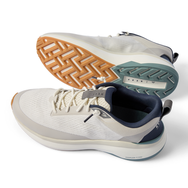 Zuma grey sneakers facing left, with breathable knit uppers, cushioned midsoles, and a textured outsole
