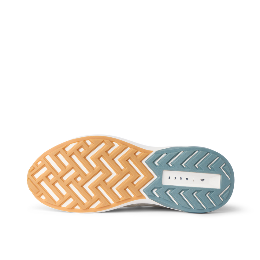 Reef Zuma sneaker outsole close up, facing left, with textured herringbone traction and cushioned sole