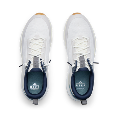Reef Zuma white sneakers viewed from above with toes facing upward, breathable knit uppers, and cushioned comfort