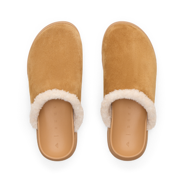 Vista Luxe Mariana clogs facing upward with tan suede uppers and soft shearling lining for comfortable everyday wear
