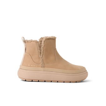 Side view of a tan shearling-lined ankle boot facing right on a black background