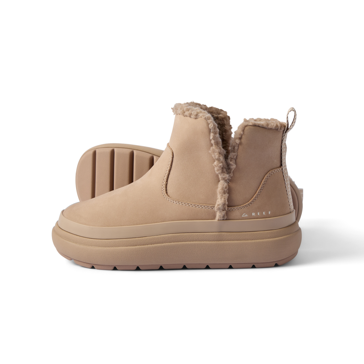 Pair of tan Weekend Autumn boots facing left with shearling lining, soft cushioning, and durable rubber sole by REEF.