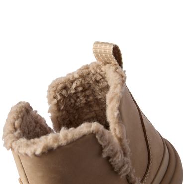 Close-up of the top opening and heel of the right Weekend Autumn shoe showing plush lining and brown leather exterior.