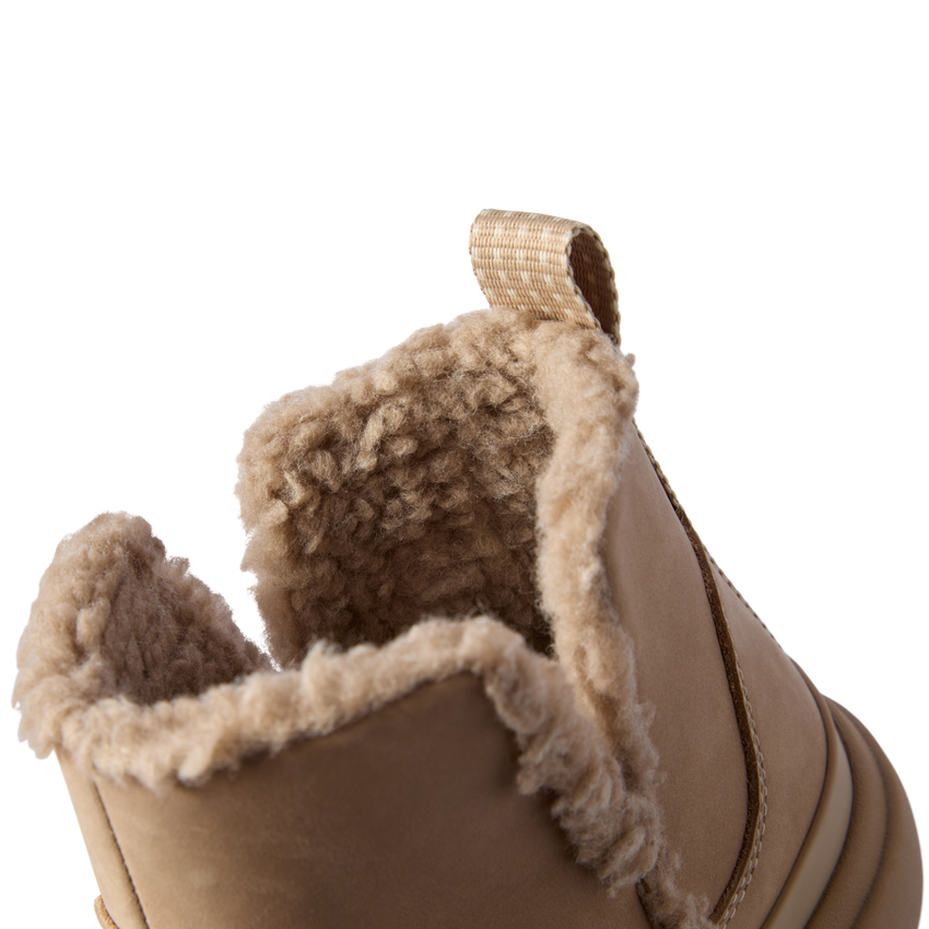 Close-up of the top opening and heel of the right Weekend Autumn shoe showing plush lining and brown leather exterior.