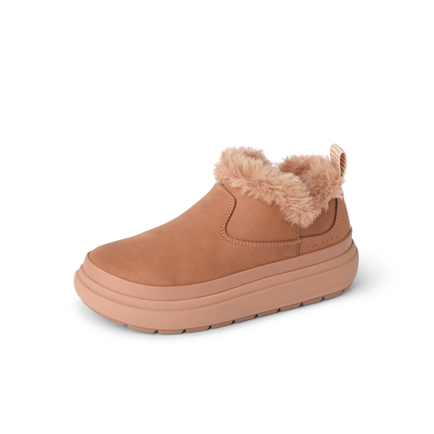 Right-facing REEF slip-on shoe with plush fur lining, cushioned sole, and durable water-friendly materials.