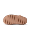 Close-up of a REEF sandal outsole facing up, showing durable, cushioned sole with textured grip lines.