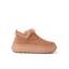 Side view of a tan slip-on shoe facing right with plush lining and thick cushioned sole for beach comfort.