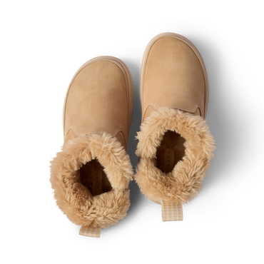 Pair of Weekend Olivia boots facing up, showing plush faux fur lining and water-resistant nubuck uppers in tan color.
