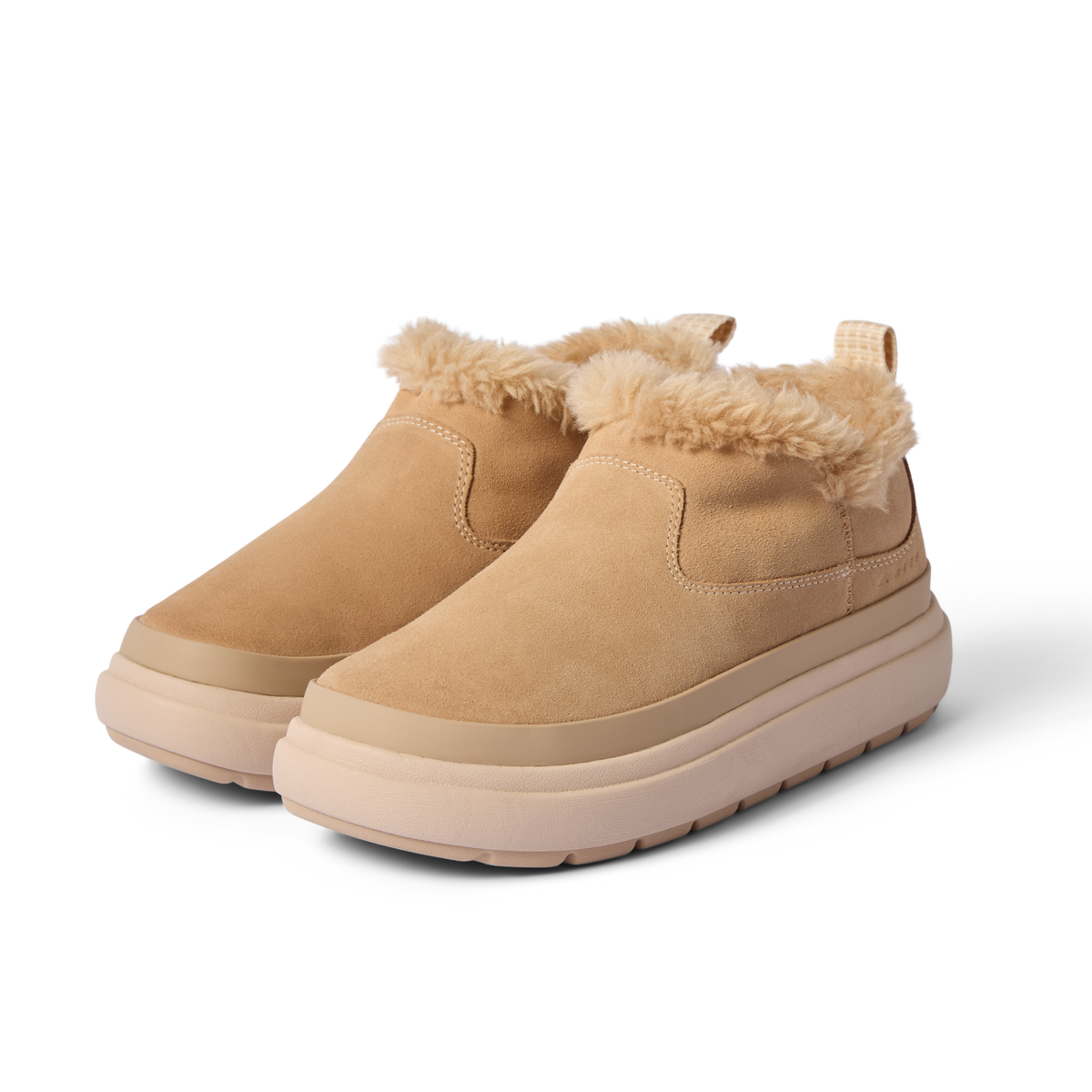 Pair of Weekend Olivia tan nubuck slip-on shoes angled left, featuring plush faux fur lining and lightweight rubber soles.